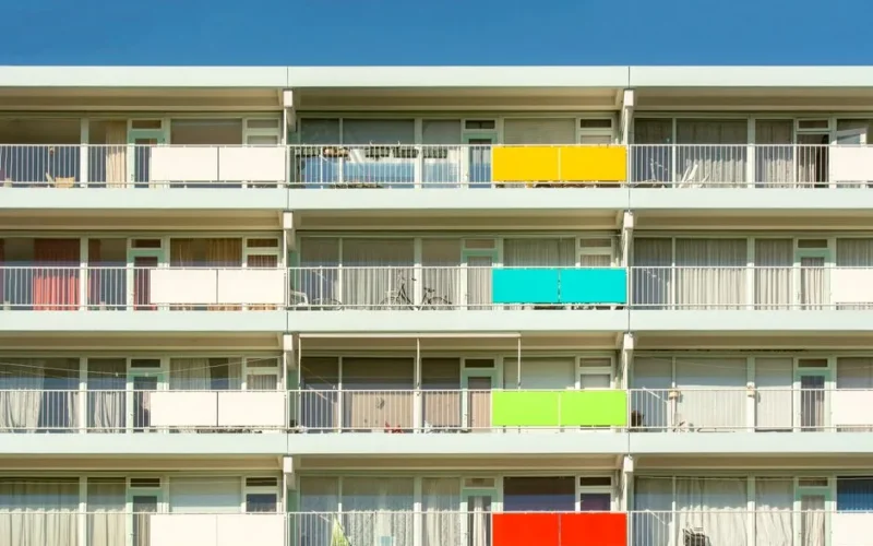 Vibrant multi-colored balconies decorate a modern apartment complex in Zoetermeer, Netherlands.
