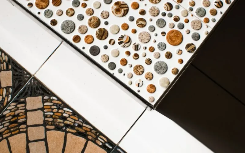 From above view of creative combination of different types of colored ceramic tiles